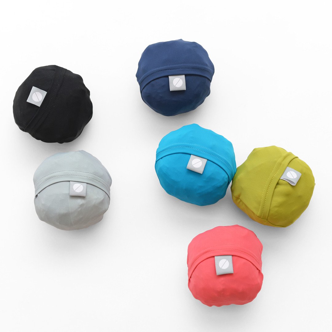 compacted drawstring backpacks in balls - foldable in seconds, making this drawstring backpack an essential packable for traveling, hiking and more
